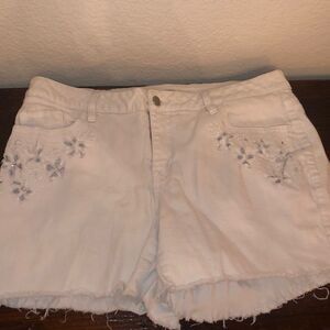 Plus size white denim shorts with floral cutouts